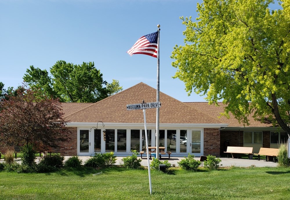 First slide. Picture of the flag pole outside of autumn park.