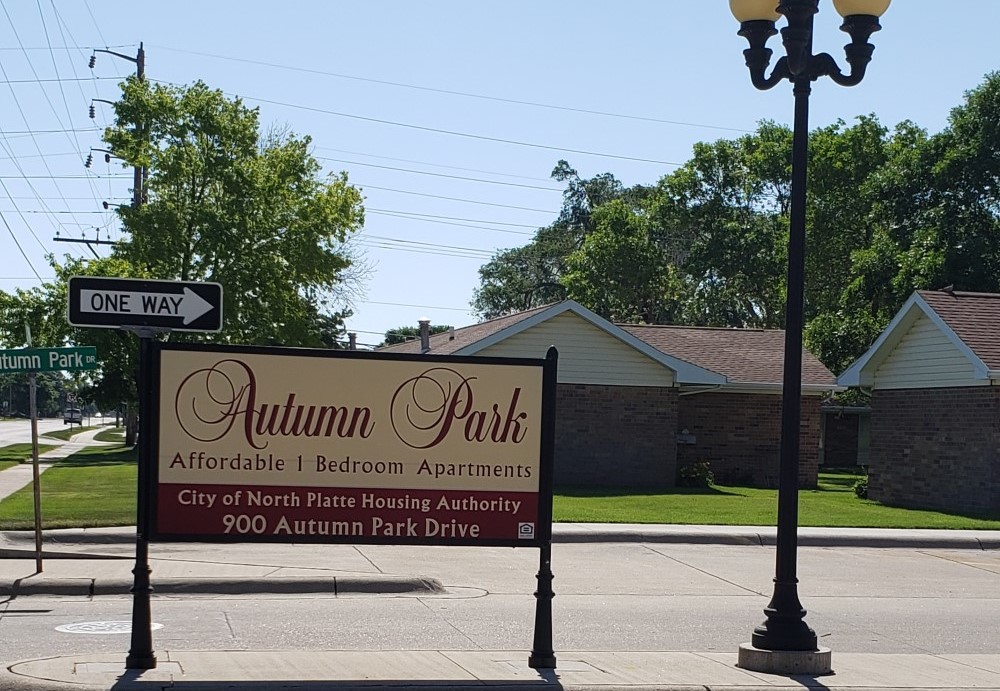 Second slide. Picture of autumn park's sign.